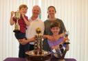 Pleased - Richard McEvoy and his family pose with the numerous trophies Picture: CHRIS RIDGWELL