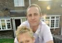 Joe, pictured with dad Lee, is now feeling much better, but his fellow pupils have been told to stay at home