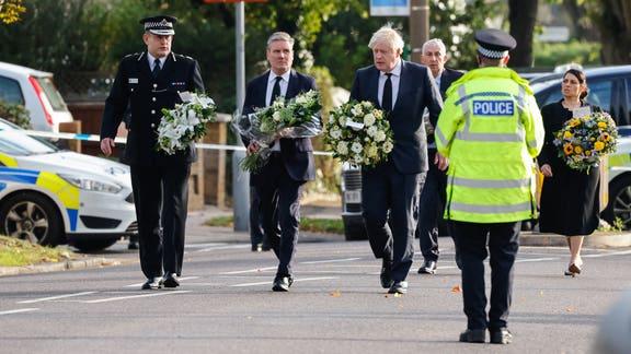 Echo: Boris Johnson and Sir Keir Starmer lay flowers at scene. (PA)