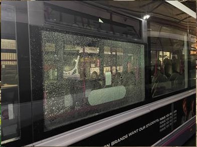 Pictures show the smashed windows of the FIrst bus