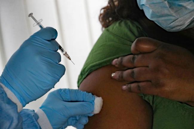 A woman is given a Covid vaccination