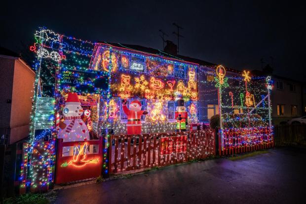Echo: The display also features several festive inflatable decorations including a giant Santa and a snowman, which Paul says are popular with kids in the area. Picture: SWNS 