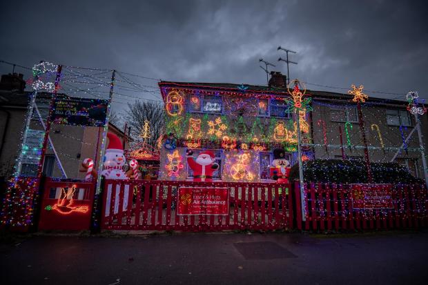 Echo: The display also features several festive inflatable decorations including a giant Santa and a snowman, which Paul says are popular with kids in the area. Picture: SWNS 