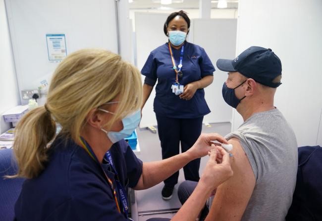 A member of the public receives the Pfizer vaccination. Pic: PA Wire