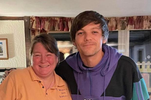 Echo: One Direction's Louis Tomlinson with landlady of The Woolpack, Dee Liberty-Spark