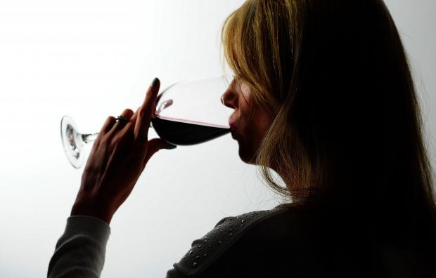 Echo: A woman drinking red wine. Credit: PA
