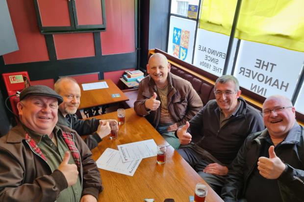 ALL SMILES: Visitors enjoying a pint at the Hanover Picture: Paul Turvey