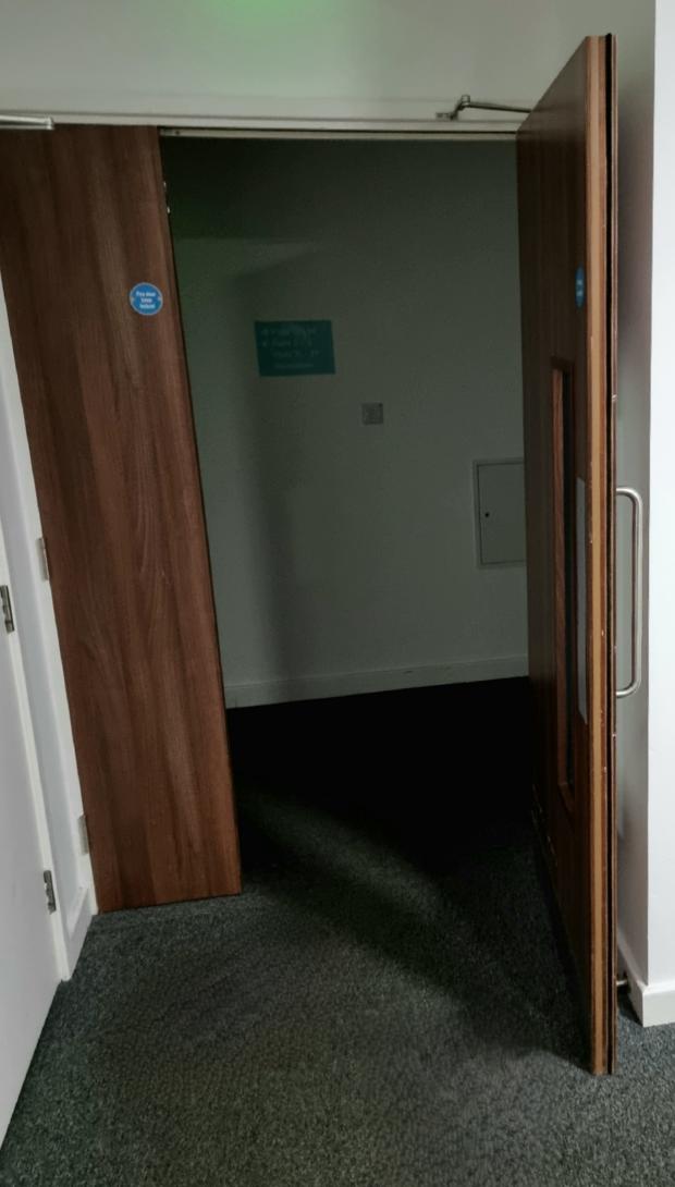 Echo: One of the wedged open doors in Trafford House 