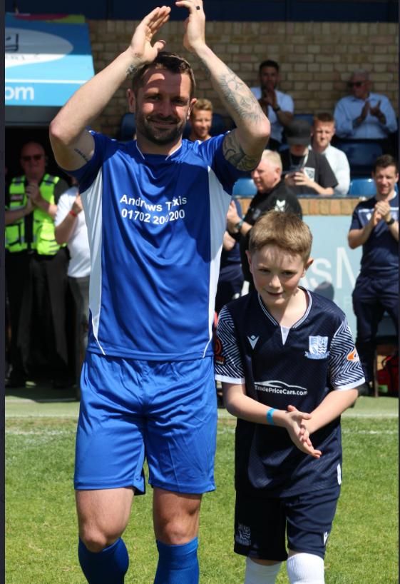 Echo: Proud - Proud - John White walks out on to the pitch alongside his son Jacob 