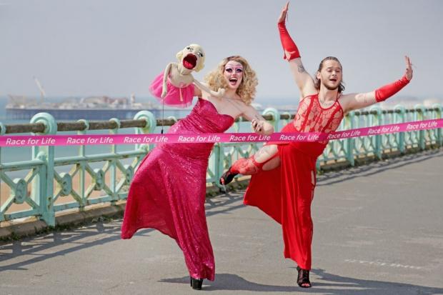 Drag queens Scarlett Fever, left, and Boss on Brighton seafront ahead of Cancer Research UK's Race For Life events