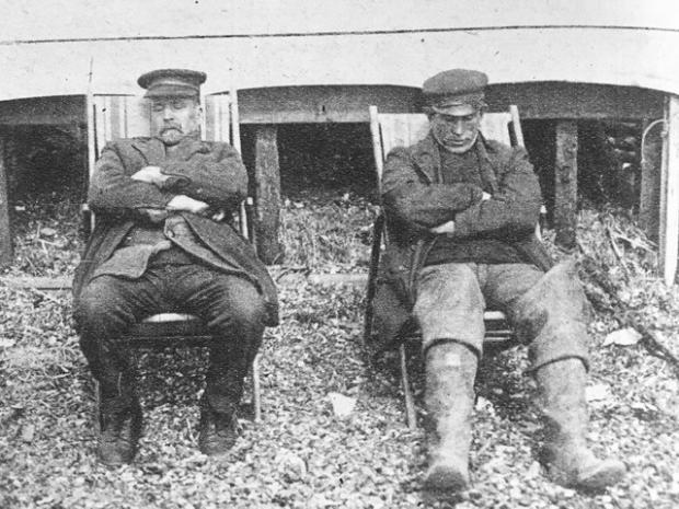 Echo: Southend boatmen napping in deckchairs on the beach as the sun becomes too much in 1922
