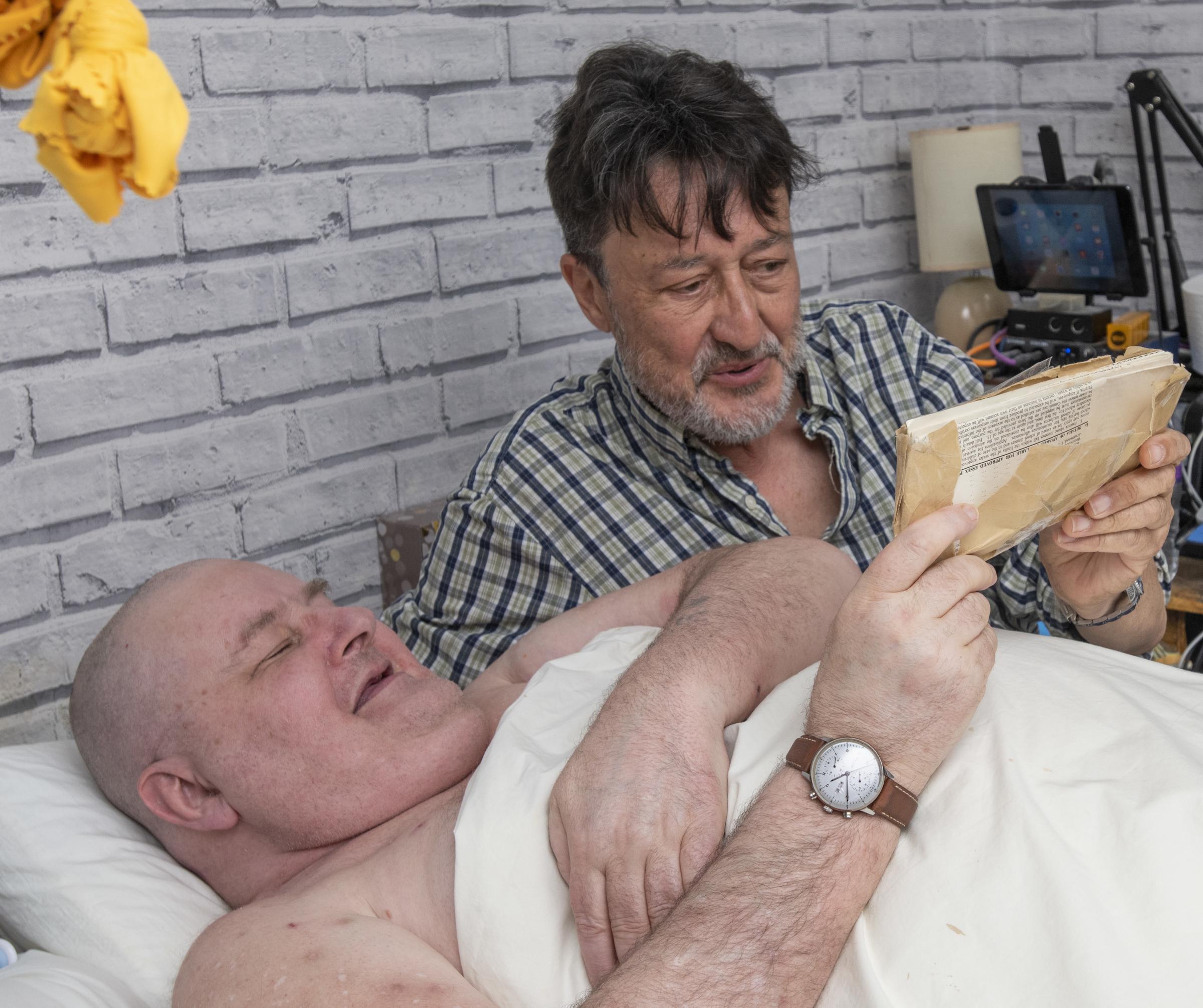 Retired mechanic, disabled Ian Cander, age 62 (in bed) who received the small package - nearly 62 years after it was posted, at his address in Chelmsford, Essex. 