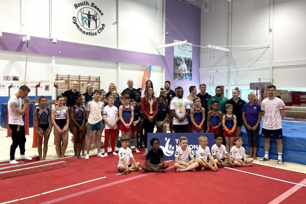 Echo: Max Whitlock (left), Georgia-Mae Fenton (centre) and Courtney Tulloch poses for photographers at the South Essex Gymnastics Club (PA)