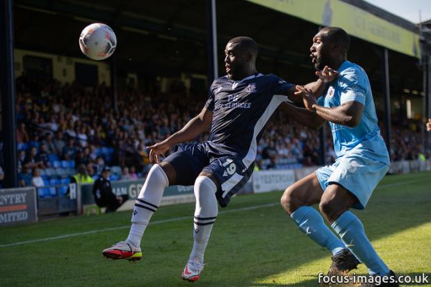 Holding off his man - Southend United forward Chris Wreh (left) came off the bench early on to make his debut