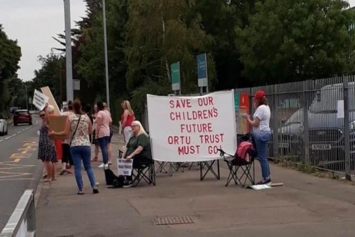 Fighting back - Parents held a protest outside the school last month
