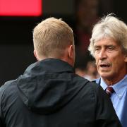 Unhappy - Manuel Pellegrini makes his point to Bournemouth boss Eddie Howe