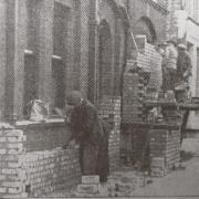 Preparing for air raids - a brick wall being built outside Southend Police Station