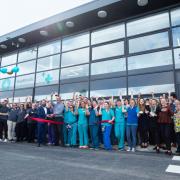 Hospital director and clinical director cut the ribbon with the rest of the team as the new £16 million Basildon animal hospital opens