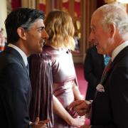 The King speaks with Rishi Sunak, during a reception at Buckingham Palace ahead of the Cop27 summit