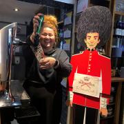 Cheers - Alice Tucker pulls a pint at the Charles and Camilla