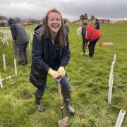 Joyful - Anna Wilson was one of a dozen volunteers who planted 100 trees.