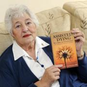 Encouraging - Heather Pratton (pictured with her book on assisted dying) has welcomed Labour leader Sir Keir Starmer's commitment.