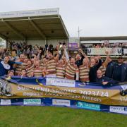 Champions - Southend Saxons hold aloft the Regional Two Anglia league trophy after making it 21 victories in succession with a fine win against Woodford on Saturday