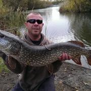 Close call — Andrew Bridge with his new personal best pike which was caught five feet from the bank