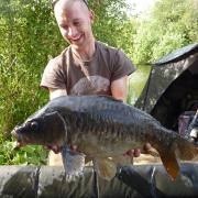 All smiles — Ed McIntosh and one of his carp