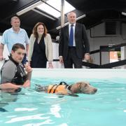 Jim Yarmouth, Rebecca Harris and Iain Duncan Smith watch Dale Walter and Ehren the dog