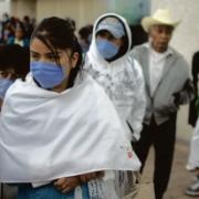 Many Mexicans are wearing face masks in the street to try to protect themselves from swine flu