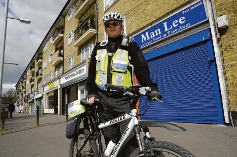 Tackling trouble – PCSO Martin  Mansfield outside the parade of shops in Cluny Square