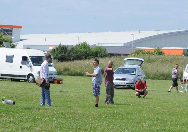 Feeling threatened – our man, above left, encounters the travellers