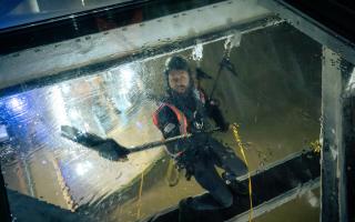 High up - workers from LDT Contractors cleaning Tower Bridge’s glass floors