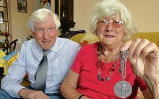 June Guild – with husband        John and her commemorative medal. Inset: A close-up