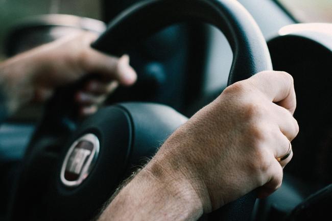 A stock image of someone driving